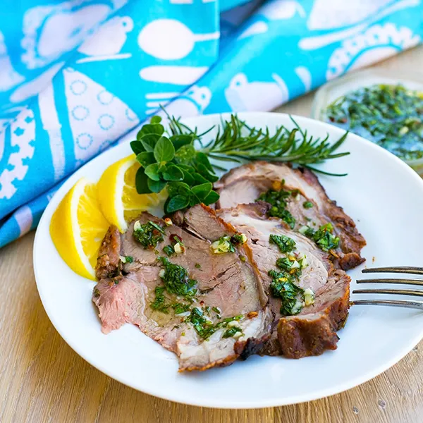Lamb al asador with chimichurri and sweet potato wedges